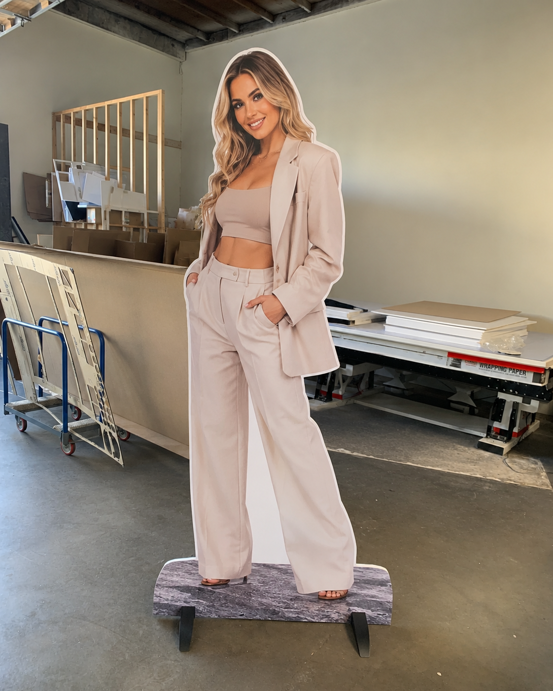 A polished creator standee photographed in the shop.